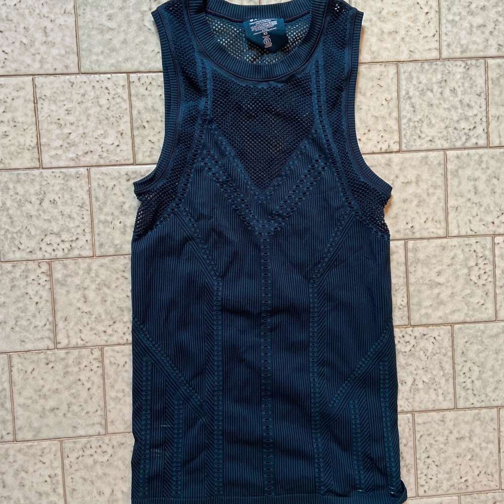 Tags removed but never worn. Athleta XS teal/black tank